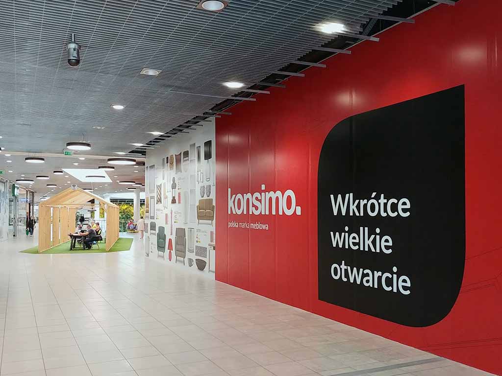 advertising on the walls Gdańsk Poland graphics on shopfront hoardings